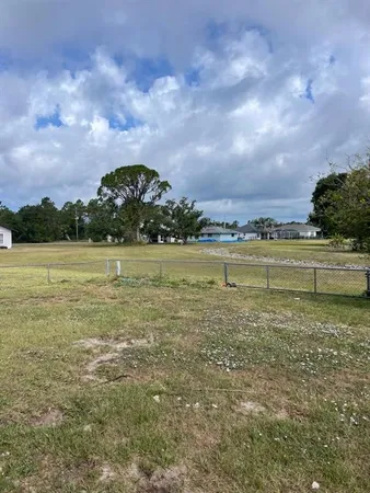 a view of a lake with a big yard