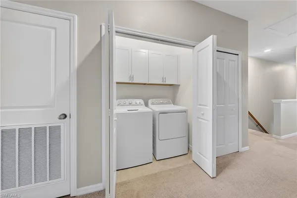 an empty room with window and ceiling fan