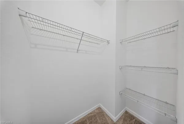 a bathroom with a double vanity sink a mirror and a bathtub
