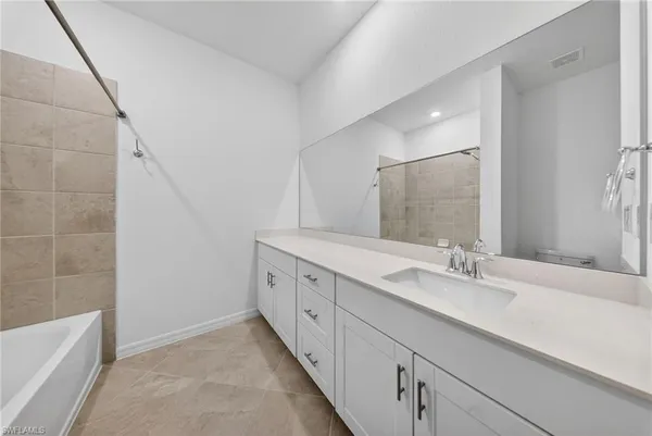 a bathroom with a sink a toilet and bathtub