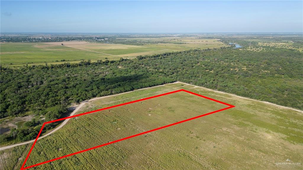 0 Eustacio Flores Road Sullivan City, TX 78595 - Photo 5 of 5 View of rural area with a heavily wooded area and property parcel outlined