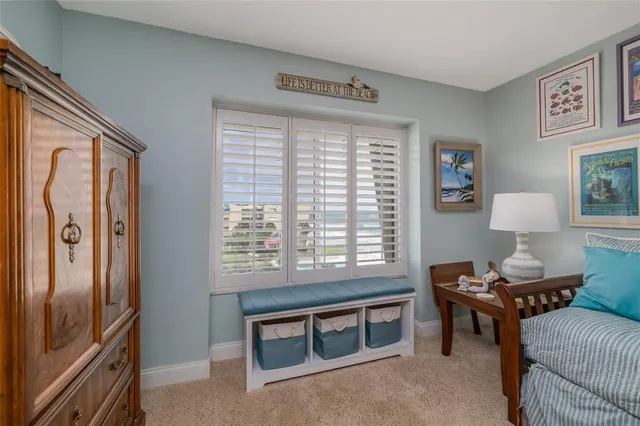 a livingroom with workspace and a window