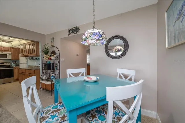 a dining room with furniture and a chandelier