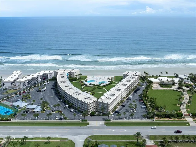a view of a swimming pool with an outdoor seating