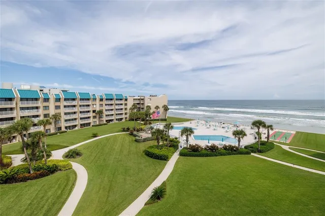 a view of a swimming pool with a patio