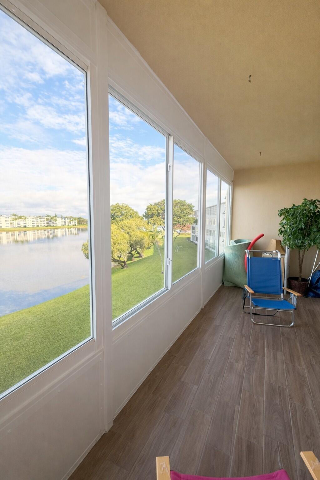 3030 Wolverton East Boca Raton, FL 33434 - Photo 11 of 13 a view of a room with furniture wooden floor and windows