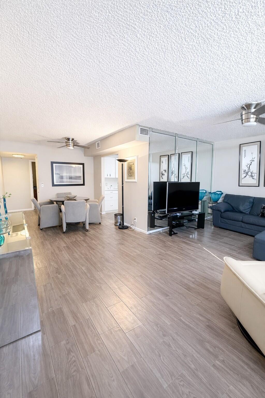 3030 Wolverton East Boca Raton, FL 33434 - Photo 3 of 13 a living room with furniture and a flat screen tv