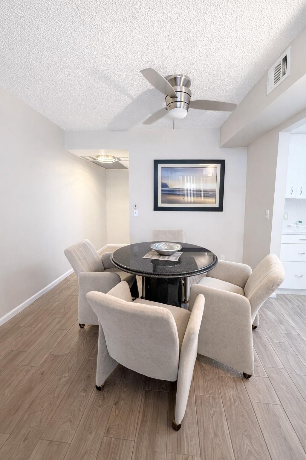 3030 Wolverton East Boca Raton, FL 33434 - Photo 4 of 13 a living room with furniture and a wooden floor
