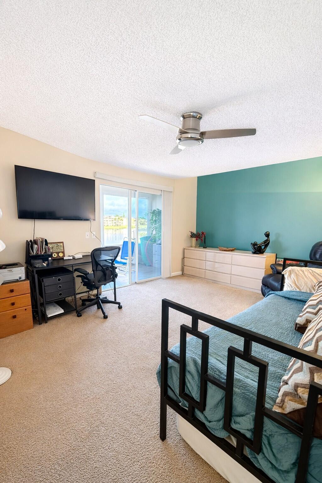 3030 Wolverton East Boca Raton, FL 33434 - Photo 8 of 13 a room with furniture and a flat screen tv