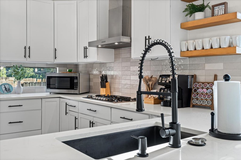 1201 Garden Street, Unit A Austin, TX 78702 - Photo 10 of 30 Culinary adventures await in this kitchen featuring abundant cabinetry and sleek, contemporary fixtures.