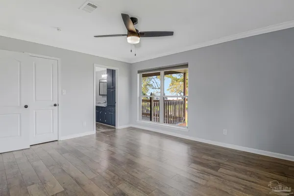 a view of balcony with wooden floor
