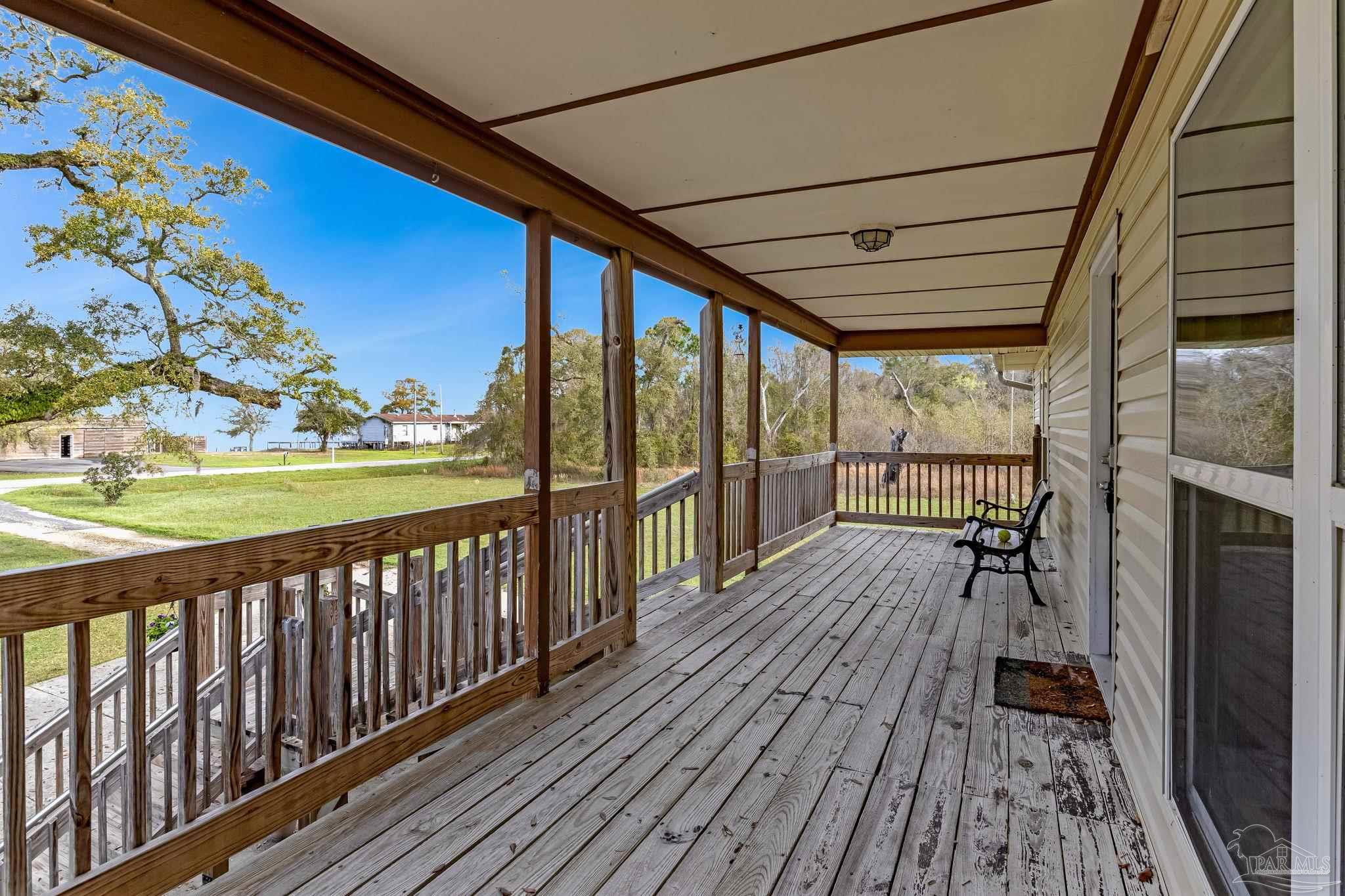302 Garcon Point Road Milton, FL 32583 - Photo 34 of 51 a view of balcony with wooden floor
