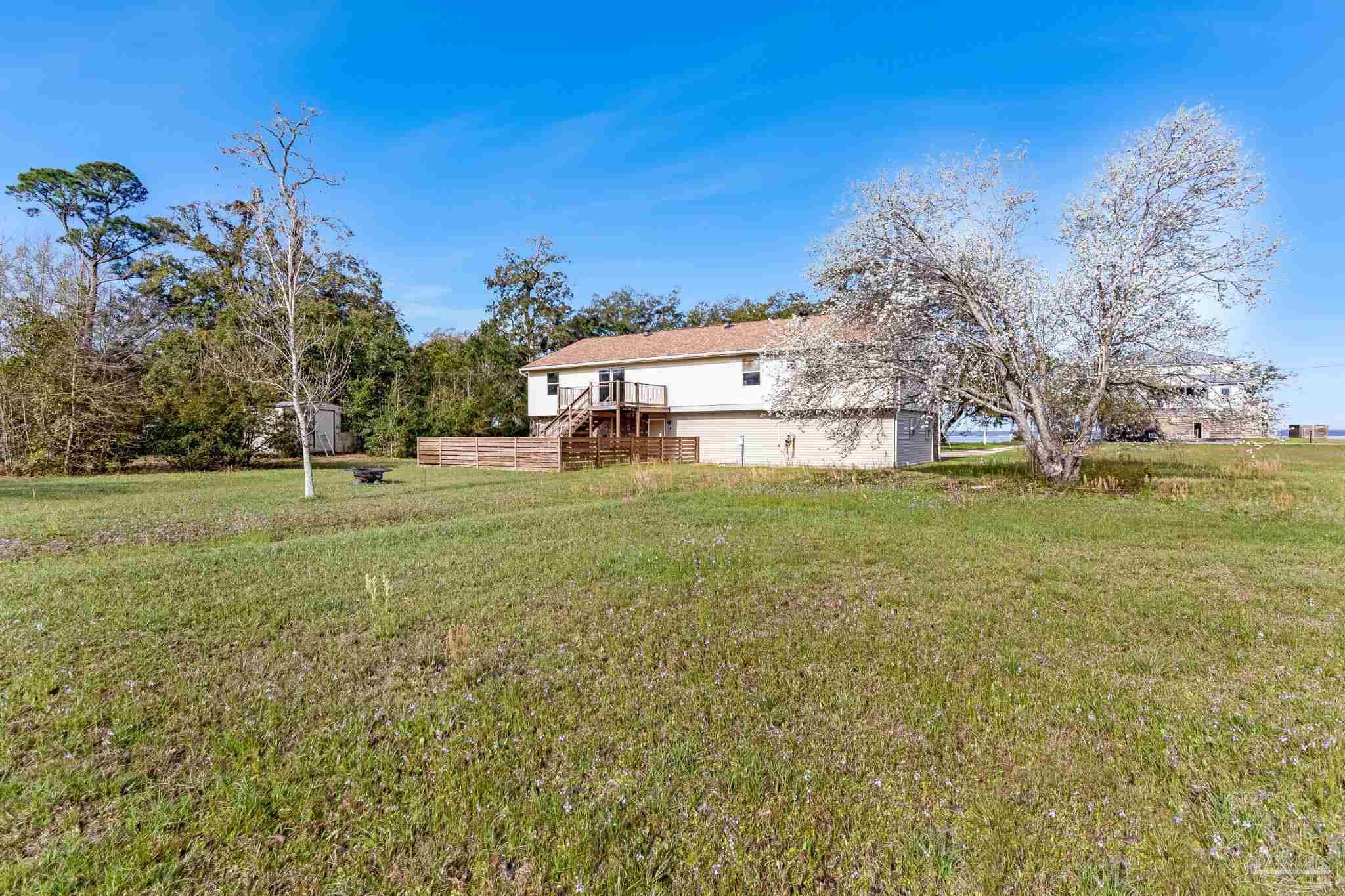 302 Garcon Point Road Milton, FL 32583 - Photo 38 of 51 a view of a field with of trees