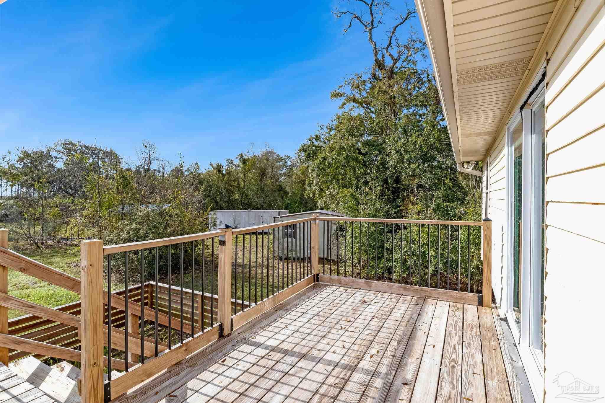 302 Garcon Point Road Milton, FL 32583 - Photo 50 of 51 a view of balcony with wooden floor and fence
