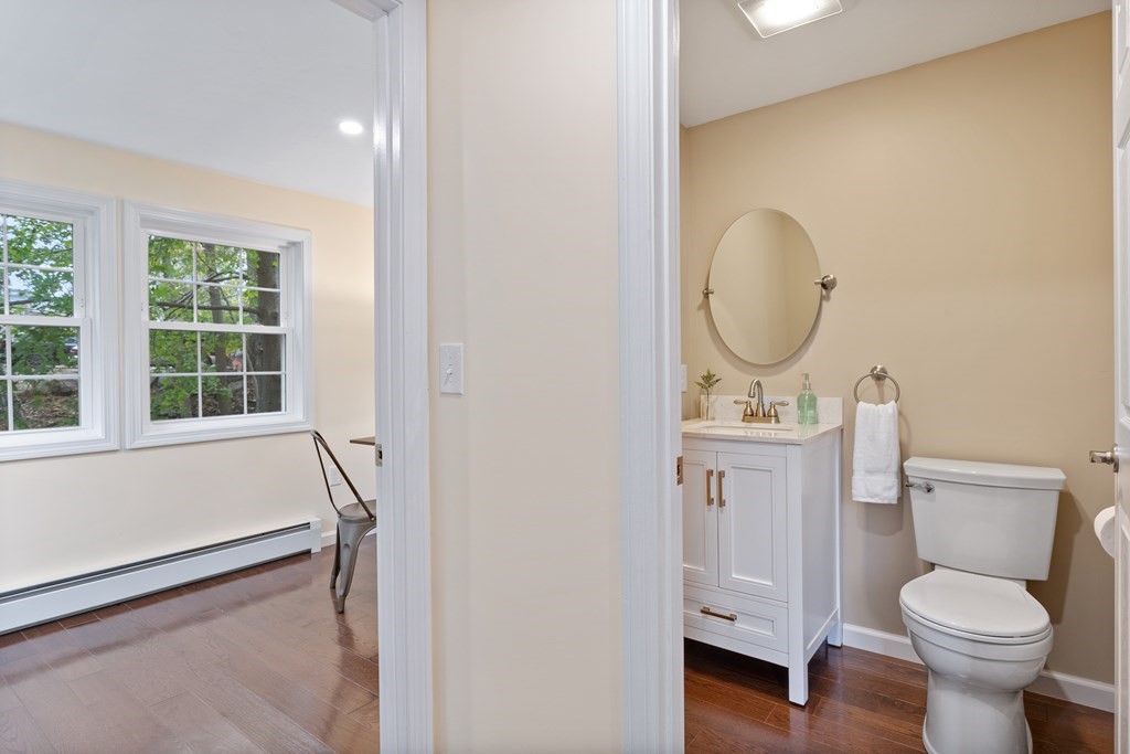 342 Great Road Stow, MA 01775 - Photo 14 of 33 a bathroom with a toilet sink and mirror