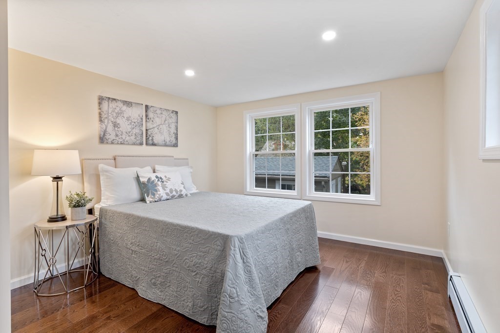 342 Great Road Stow, MA 01775 - Photo 18 of 33 a bedroom with a large bed and a window