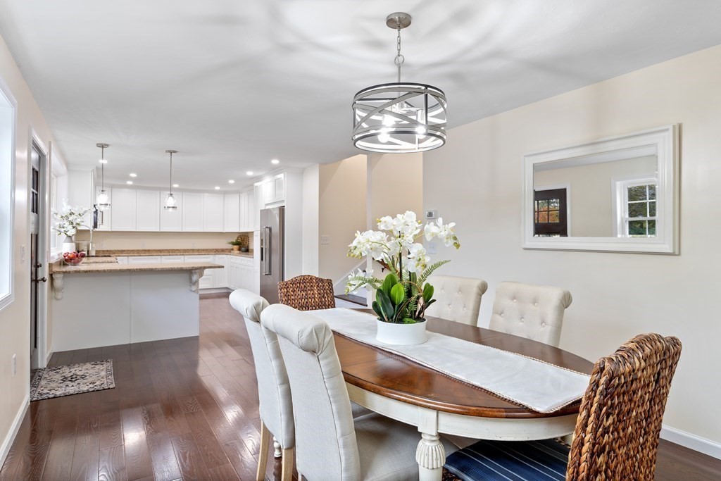 342 Great Road Stow, MA 01775 - Photo 2 of 33 a dining room filled chandelier and wooden floor