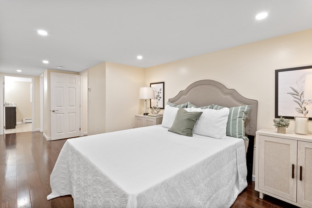 342 Great Road Stow, MA 01775 - Photo 21 of 33 a bed room with a bed and a night stand
