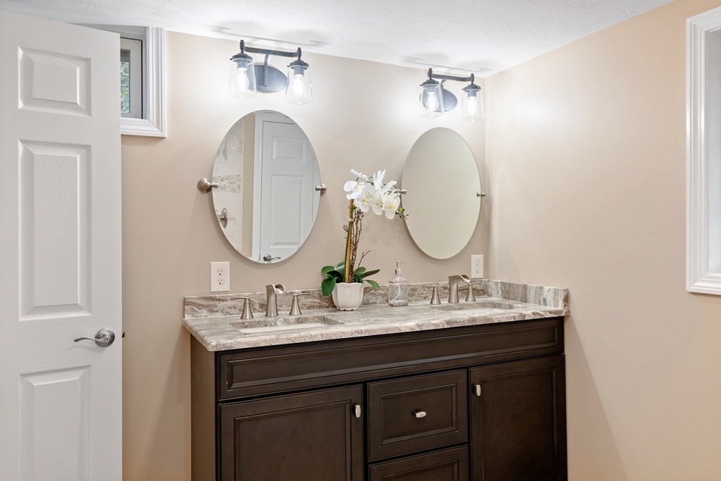 342 Great Road Stow, MA 01775 - Photo 23 of 33 a bathroom with a sink and a mirror