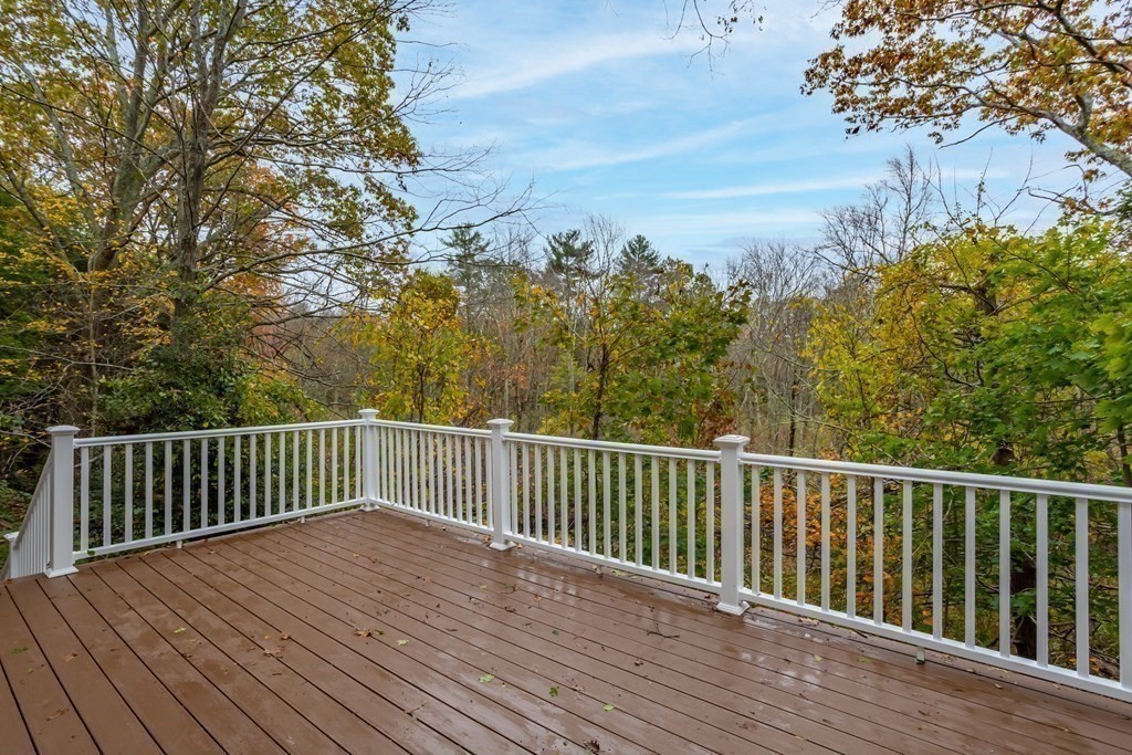 342 Great Road Stow, MA 01775 - Photo 26 of 33 a view of balcony with wooden floor and fence