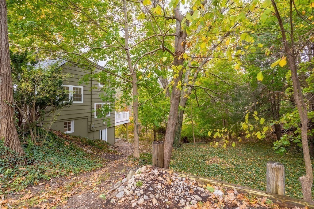 342 Great Road Stow, MA 01775 - Photo 31 of 33 a view of a house with a tree in the yard
