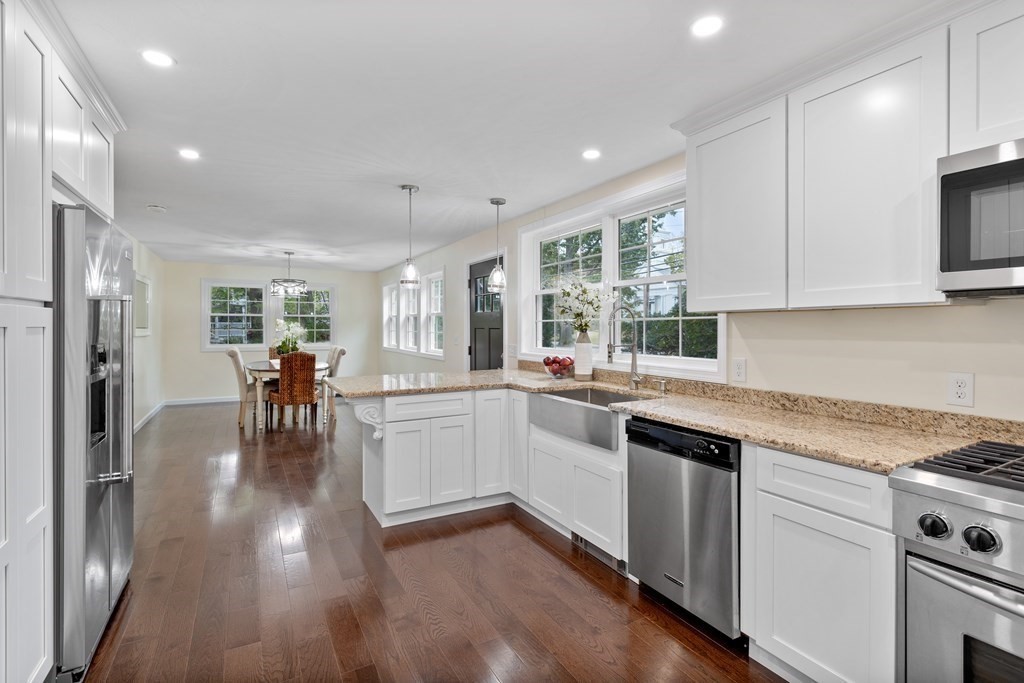 342 Great Road Stow, MA 01775 - Photo 4 of 33 a kitchen with white cabinets and appliances