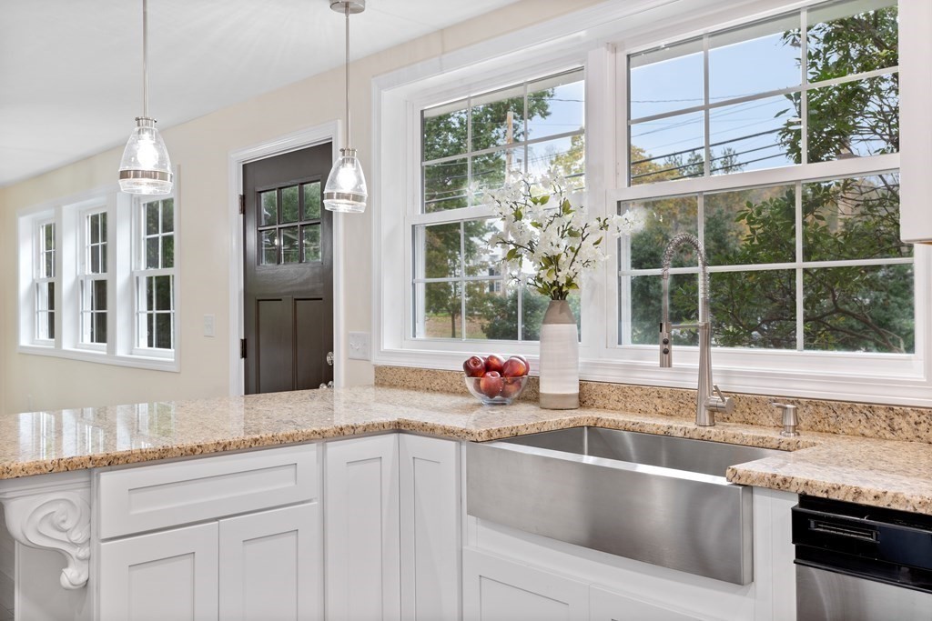 342 Great Road Stow, MA 01775 - Photo 6 of 33 a kitchen with granite countertop a sink and a window