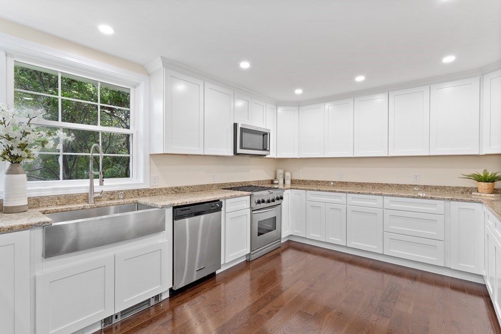 342 Great Road Stow, MA 01775 - Photo 7 of 33 a kitchen that has a sink and a stove in it