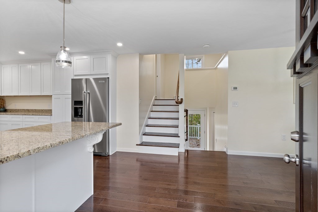 342 Great Road Stow, MA 01775 - Photo 8 of 33 a view of entryway and hall with wooden floor