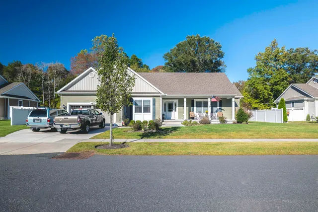 a view of house with outdoor space and swimming pool