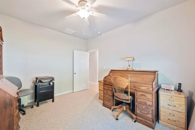 a view of a workspace with furniture