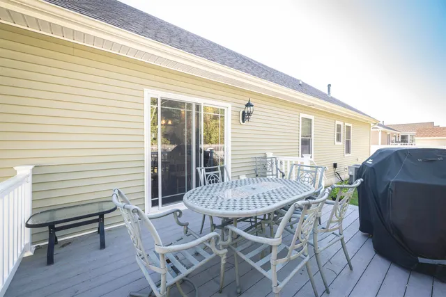 a view of a house with a table and chairs