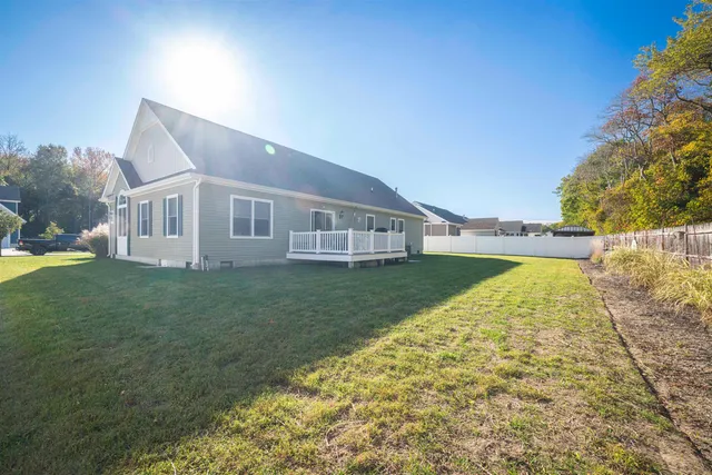 a view of house with backyard