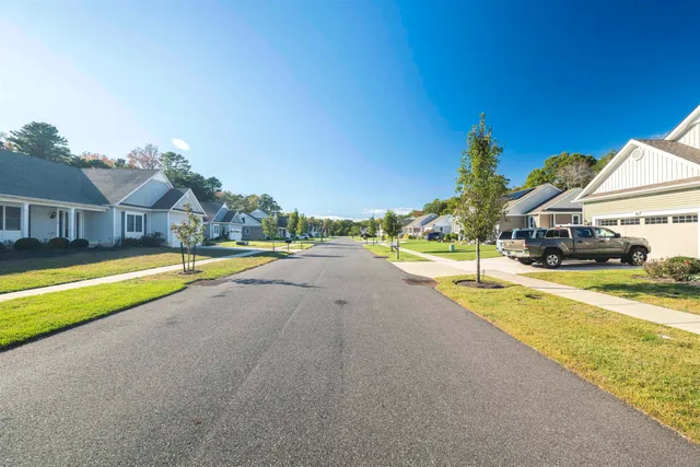 a view of a swimming pool with outdoor seating and yard