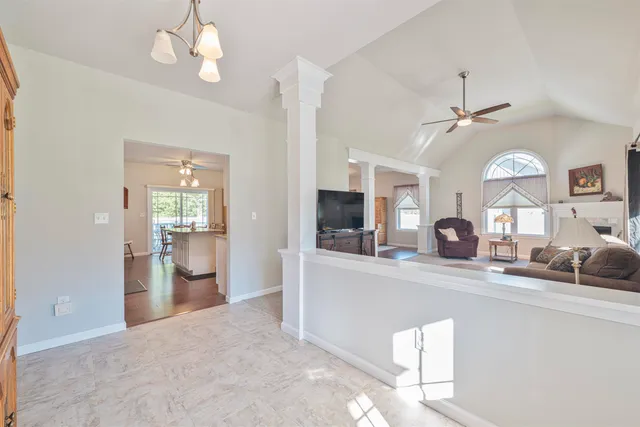 a view of a kitchen and a window in the kitchen