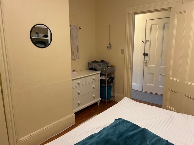 a bedroom with a bed and a cabinets