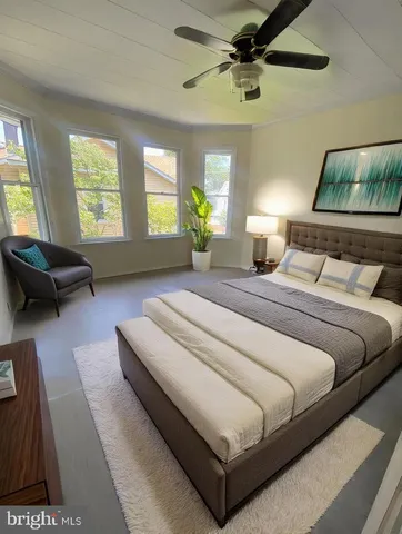 a bedroom with bed and window