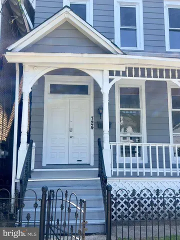 a front view of a building with glass windows