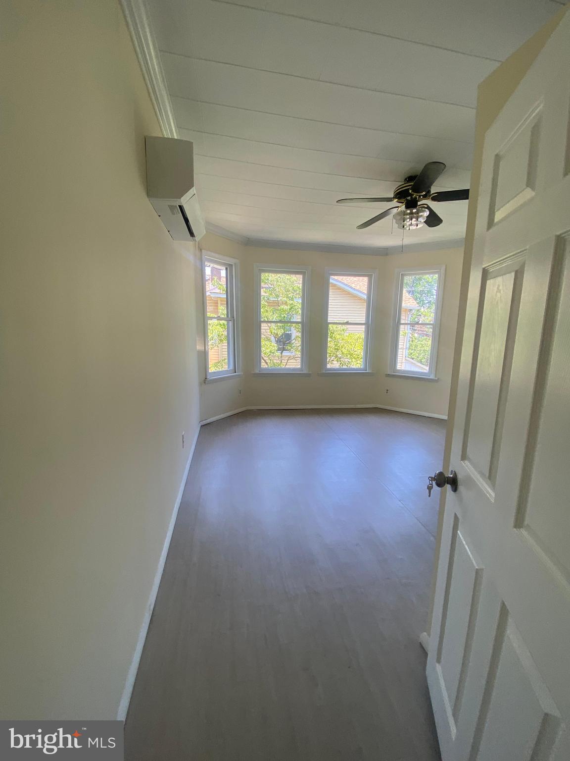 724 Hunter Street Gloucester City, NJ 08030 - Photo 30 of 47 wooden floor in an empty room with a window