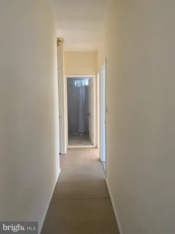 a view of hallway with closet