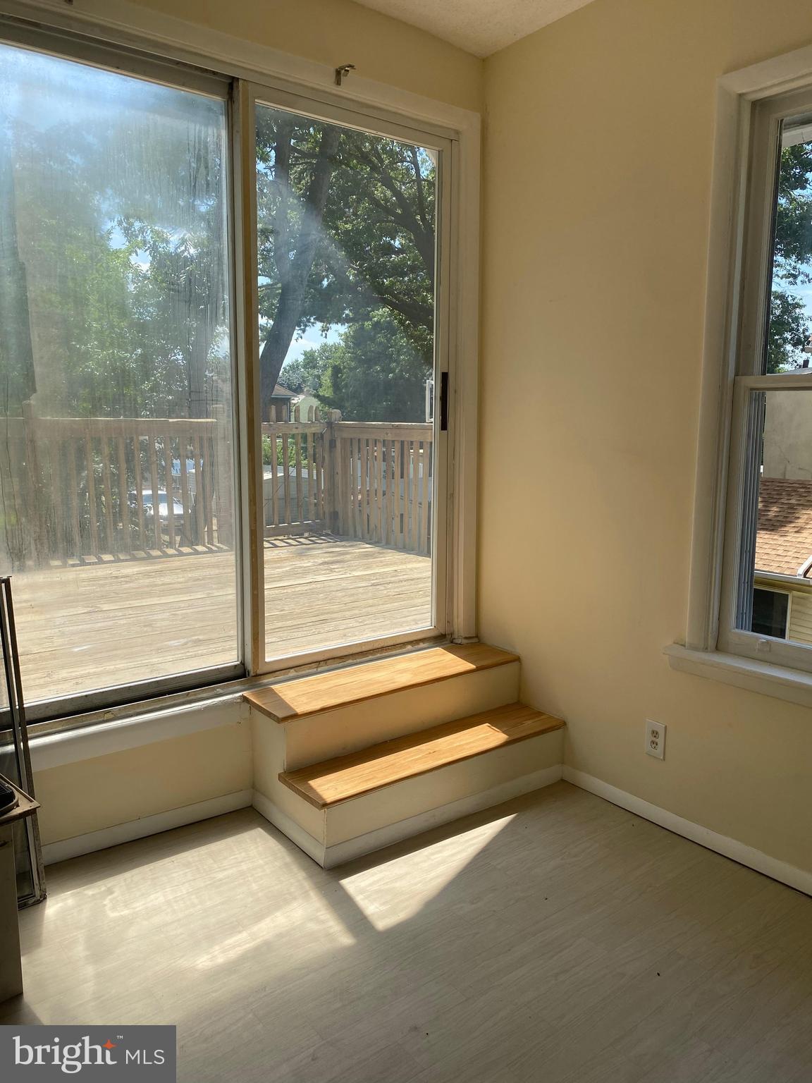 724 Hunter Street Gloucester City, NJ 08030 - Photo 34 of 47 a view of an empty room with a floor to ceiling window and a floor to ceiling window