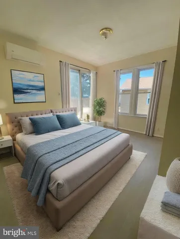 a bedroom with a large bed and a couch