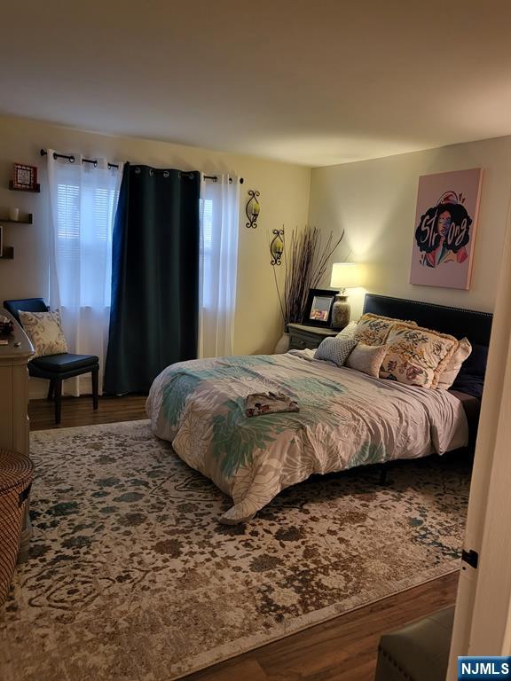 205 Bergen Turnpike, Unit 2A Ridgefield Park, NJ 07660 - Photo 11 of 13 a bedroom with a bed and dresser