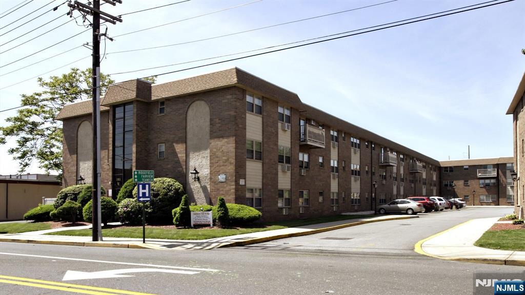 205 Bergen Turnpike, Unit 2A Ridgefield Park, NJ 07660 - Photo 2 of 13 a city street with a building and a street light on the side of a road