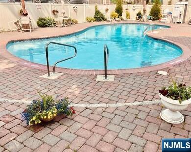205 Bergen Turnpike, Unit 2A Ridgefield Park, NJ 07660 - Photo 3 of 13 a bathroom with a sink and a mirror