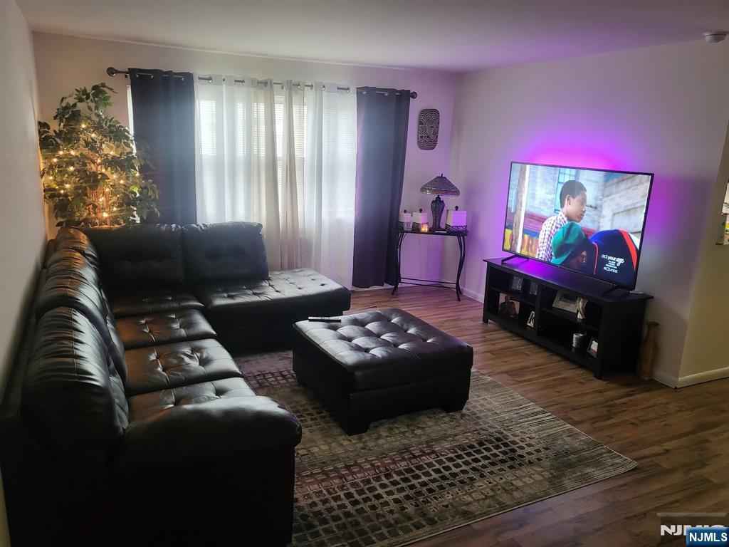 205 Bergen Turnpike, Unit 2A Ridgefield Park, NJ 07660 - Photo 4 of 13 a living room with furniture and a flat screen tv