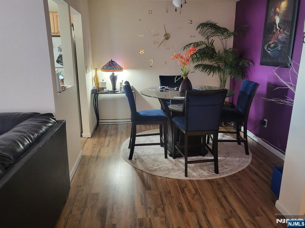 205 Bergen Turnpike, Unit 2A Ridgefield Park, NJ 07660 - Photo 7 of 13 a dining room with furniture and wooden floor