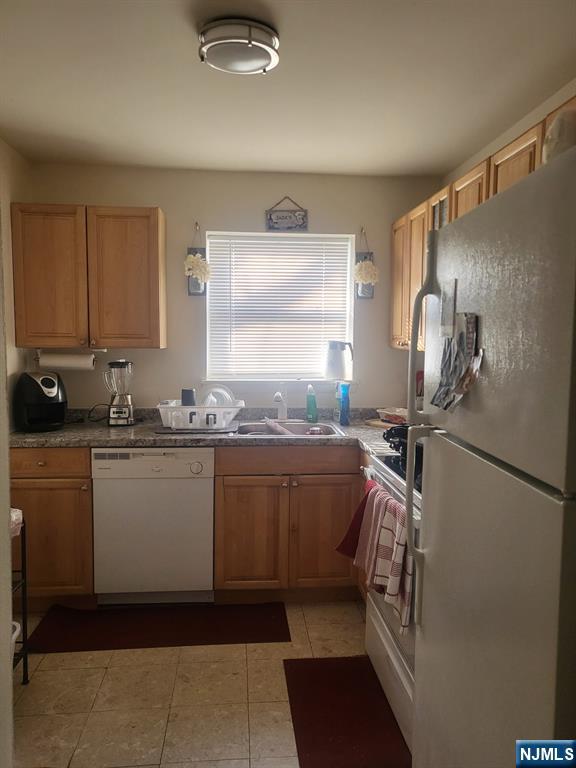 205 Bergen Turnpike, Unit 2A Ridgefield Park, NJ 07660 - Photo 9 of 13 a kitchen with granite countertop a sink and cabinets