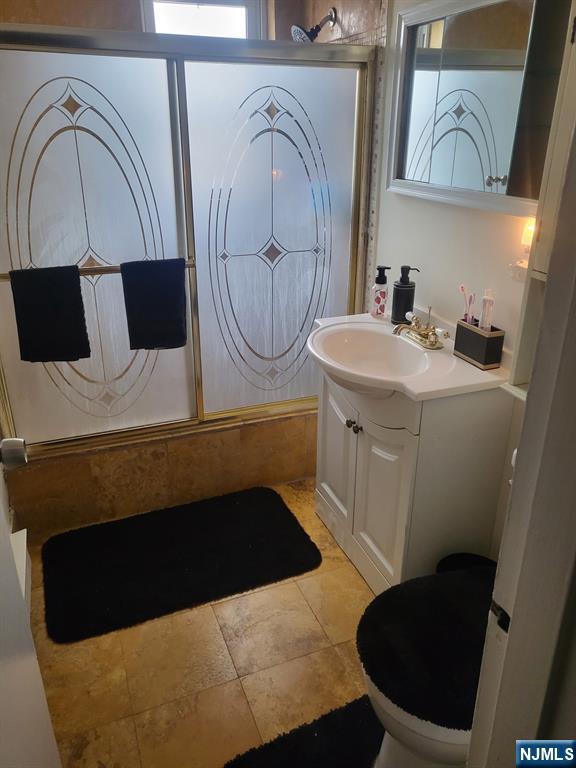 205 Bergen Turnpike, Unit 2A Ridgefield Park, NJ 07660 - Photo 10 of 13 a bathroom with a sink and a mirror