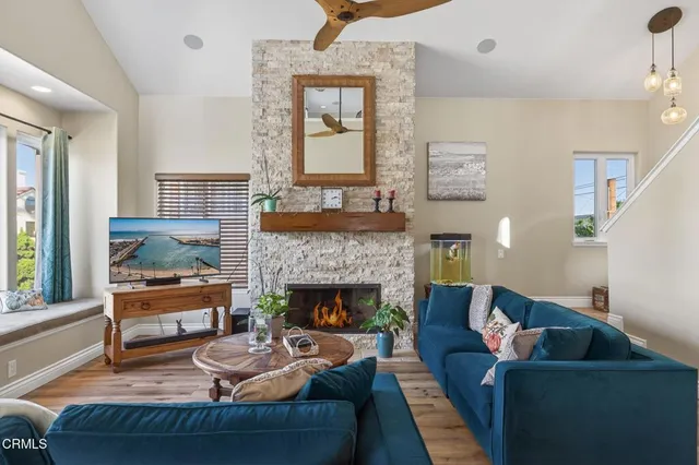 a living room with furniture and a fireplace